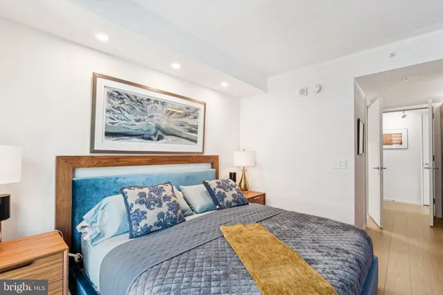 a bathroom with a sink mirror vanity and toilet