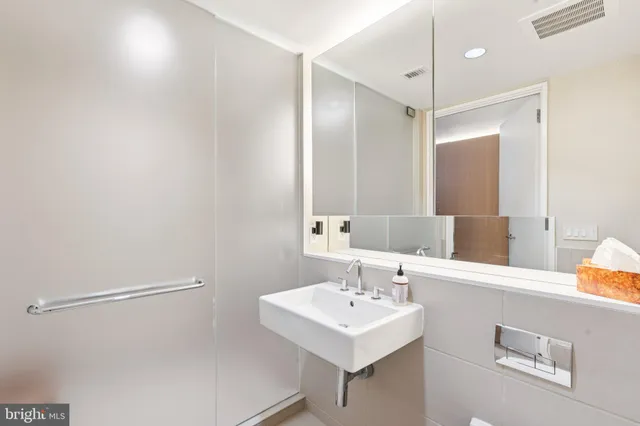 a view of hallway with wooden floor