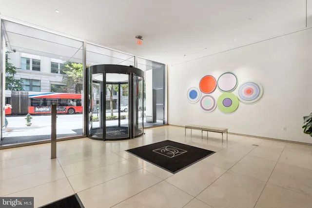 a view of a lobby with furniture and a potted plant