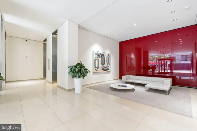 a view of a patio with couches table and chairs and potted plants