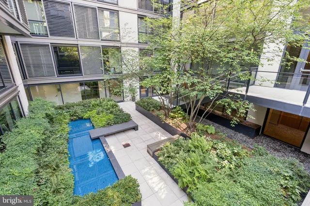 a view of a backyard with sitting area