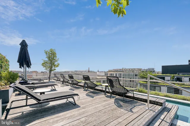 a outdoor space with a large window and furniture