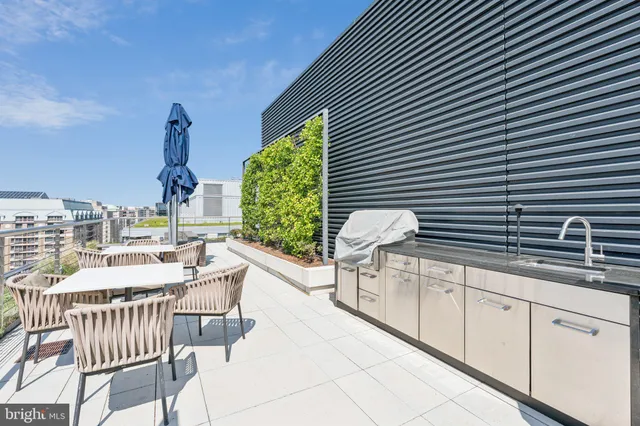 a view of a chairs and table in a patio