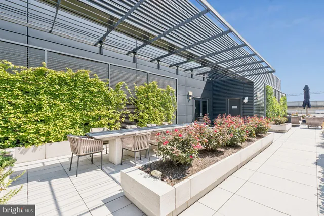 a living room with furniture and a book shelf