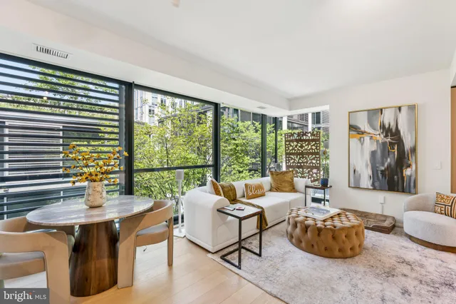 a view of a hallway with paintings on the wall