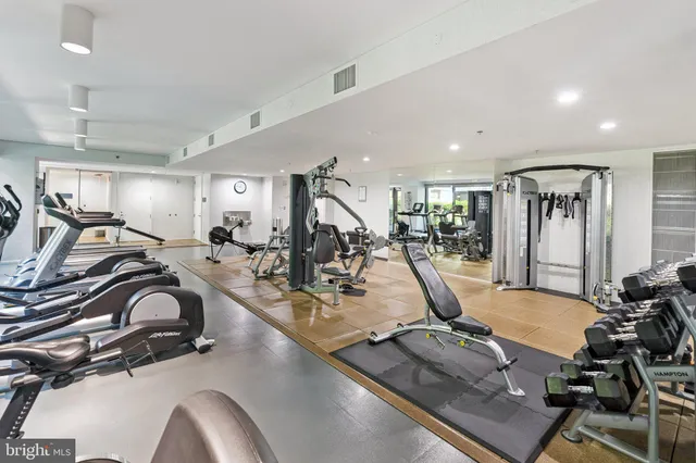 a bathroom with a sink mirror and toilet
