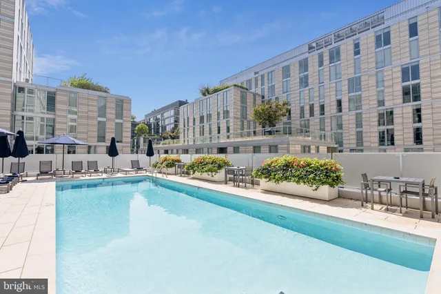 a view of pool with tree s