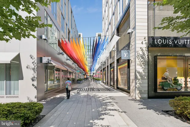 a view of balcony with floor to ceiling windows and wooden floor