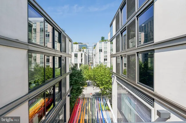 a view of tall buildings with street