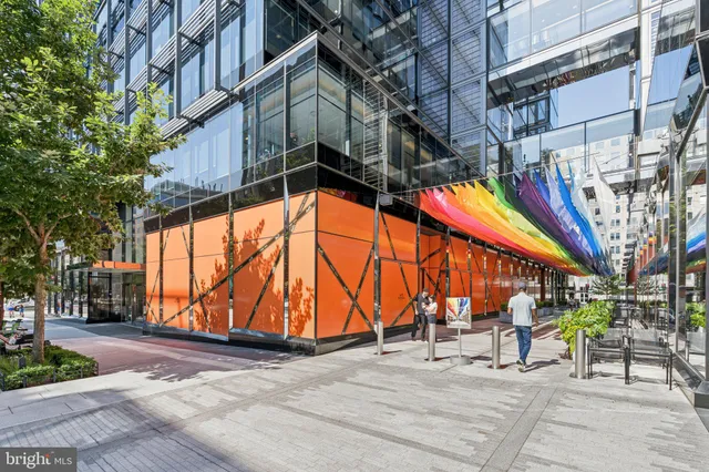 a view of a building with a potted plant windows