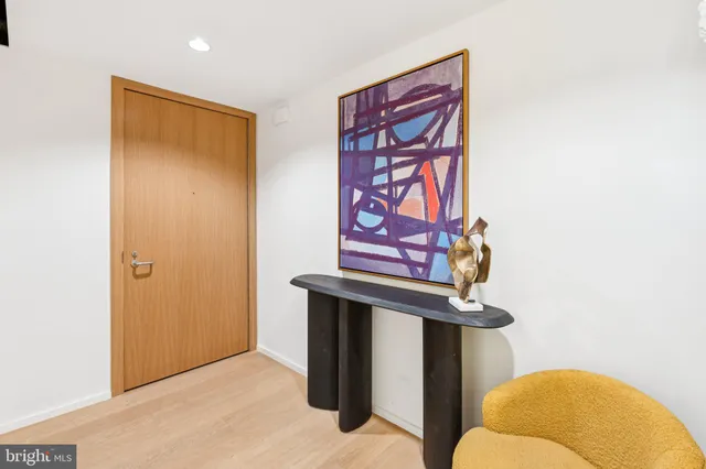 a bathroom with a sink mirror and vanity