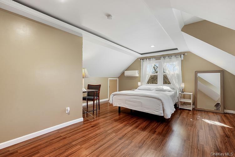 199 S Road White Plains, NY 10603 - Photo 12 of 17 a bedroom with a bed and wooden floor