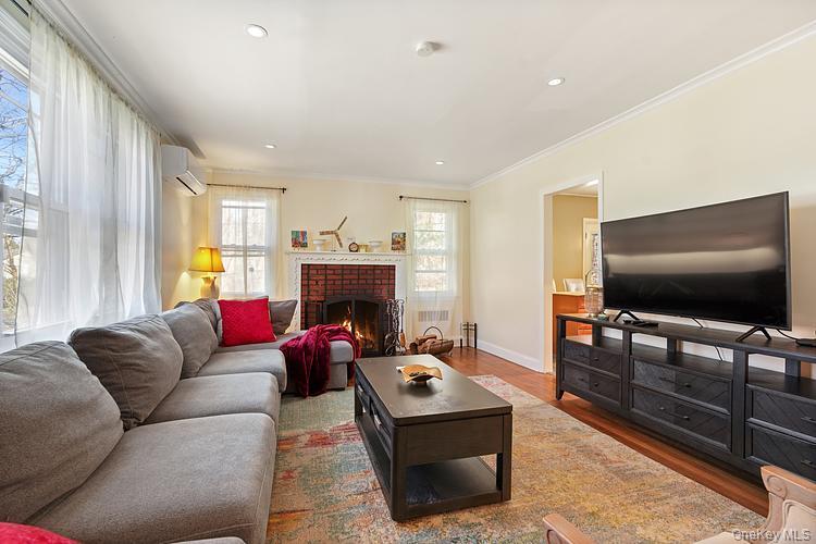 199 S Road White Plains, NY 10603 - Photo 3 of 17 a living room with furniture a flat screen tv and a fireplace