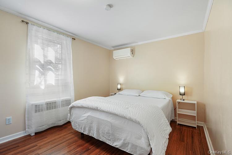 199 S Road White Plains, NY 10603 - Photo 10 of 17 a bedroom with a bed and wooden floor