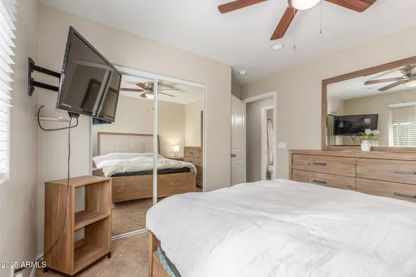 a kitchen with kitchen island stainless steel appliances a stove refrigerator and microwave