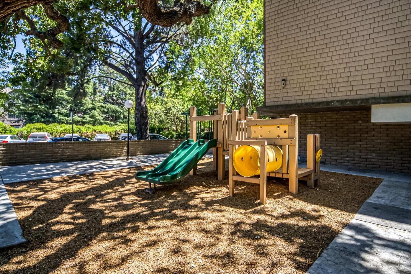 49 Showers Drive, Unit A134 Mountain View, CA 94040 - Photo 20 of 22 a view of a swimming pool with a lounge chair