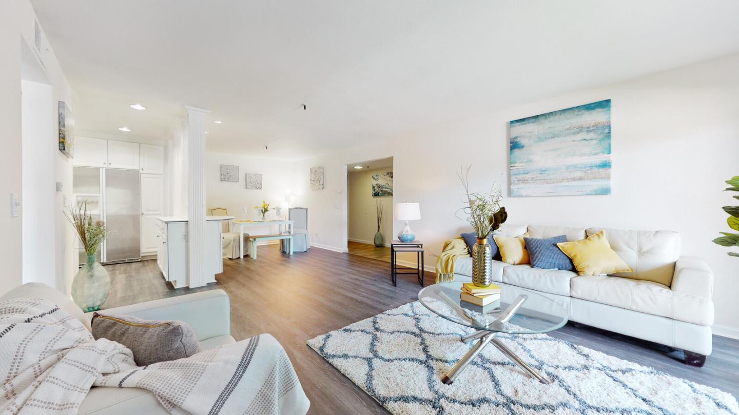 49 Showers Drive, Unit A134 Mountain View, CA 94040 - Photo 3 of 22 a living room with furniture and kitchen view with wooden floor