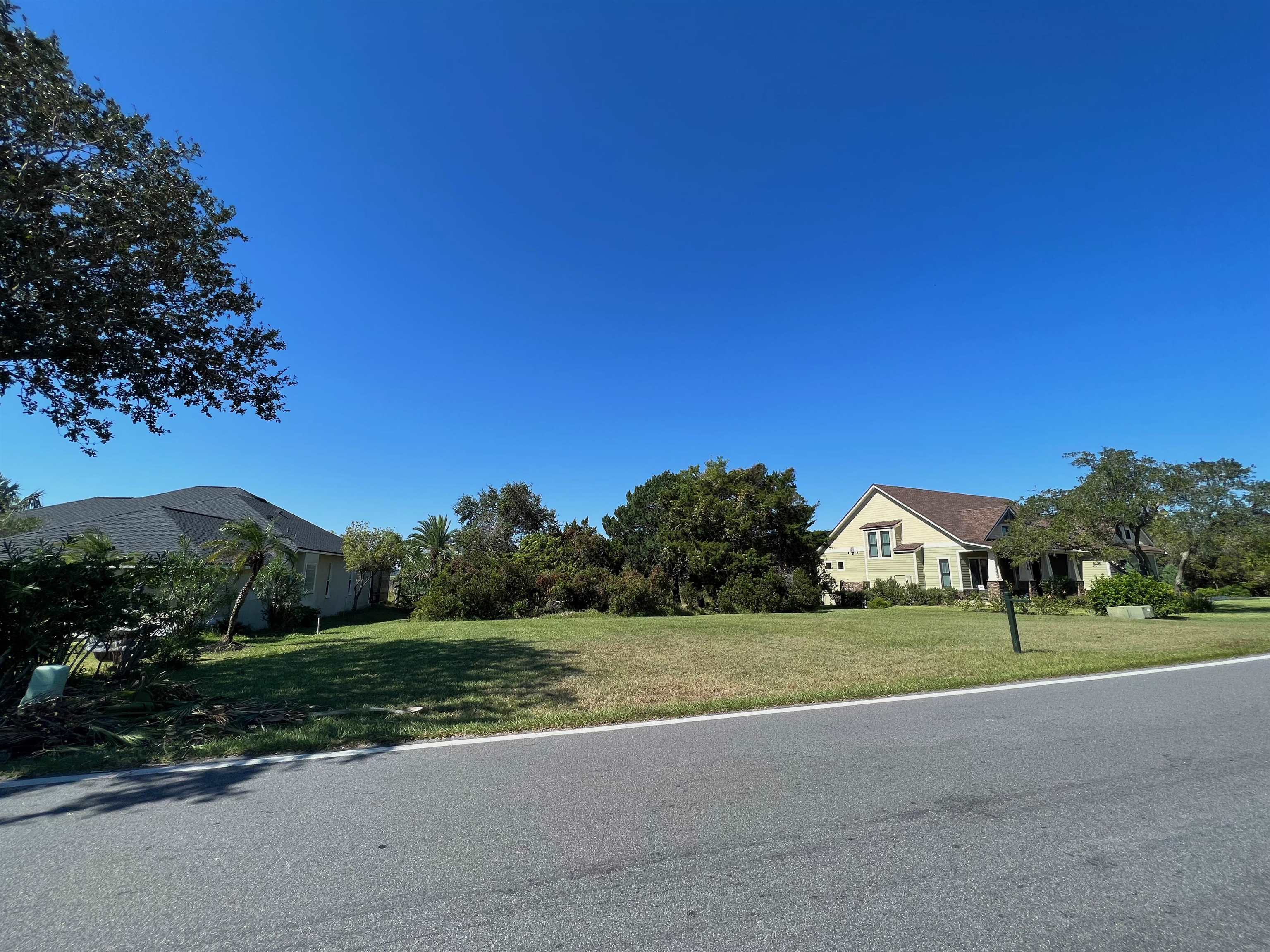 143 Marshside Drive St. Augustine, FL 32080 - Photo 16 of 16 a view of green field with house in background