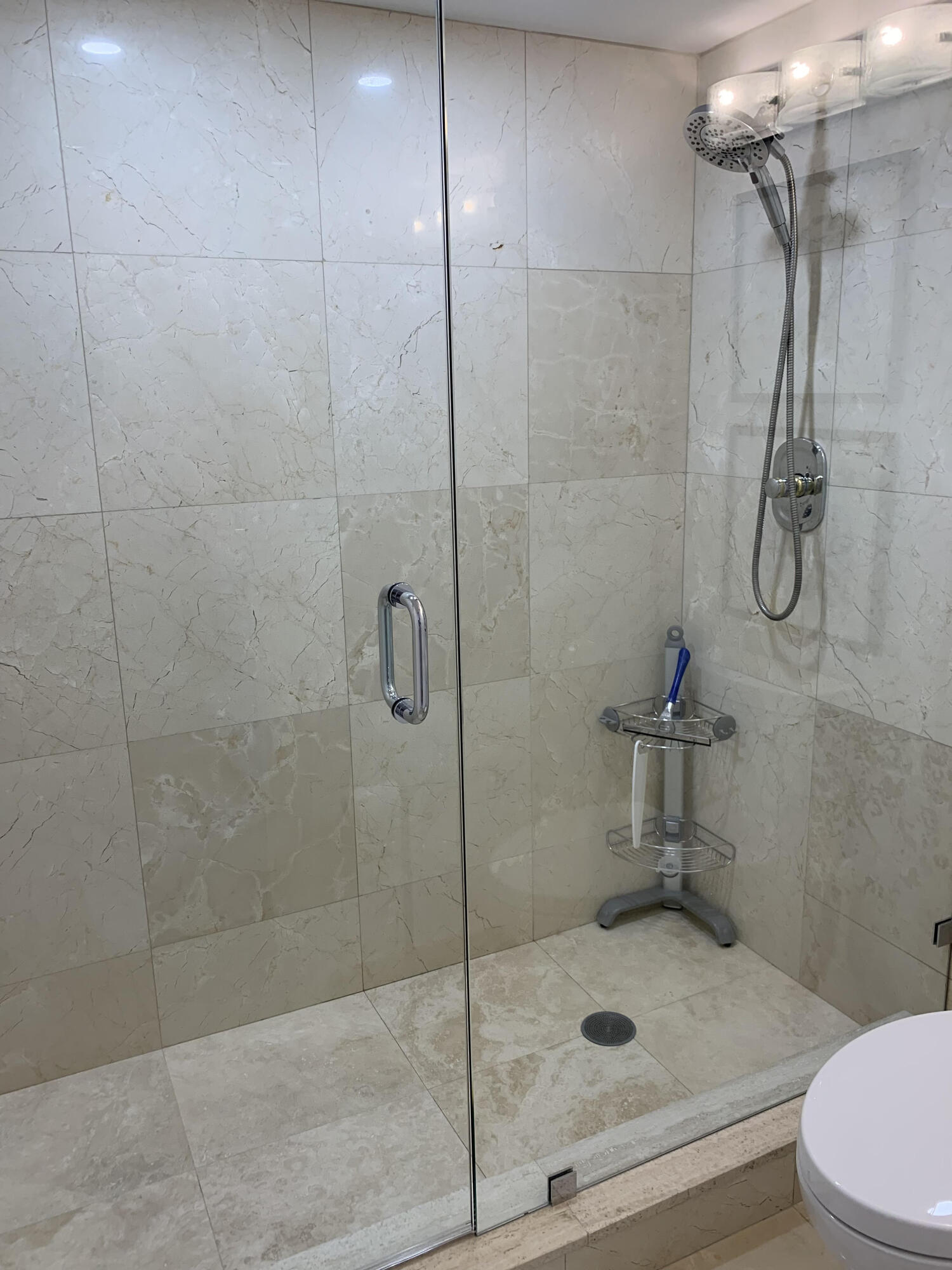3115 South Ocean Boulevard, Unit 1002 Highland Beach, FL 33487 - Photo 21 of 37 a bathroom with a shower and toilet
