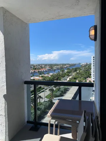 a view of balcony with furniture and city view