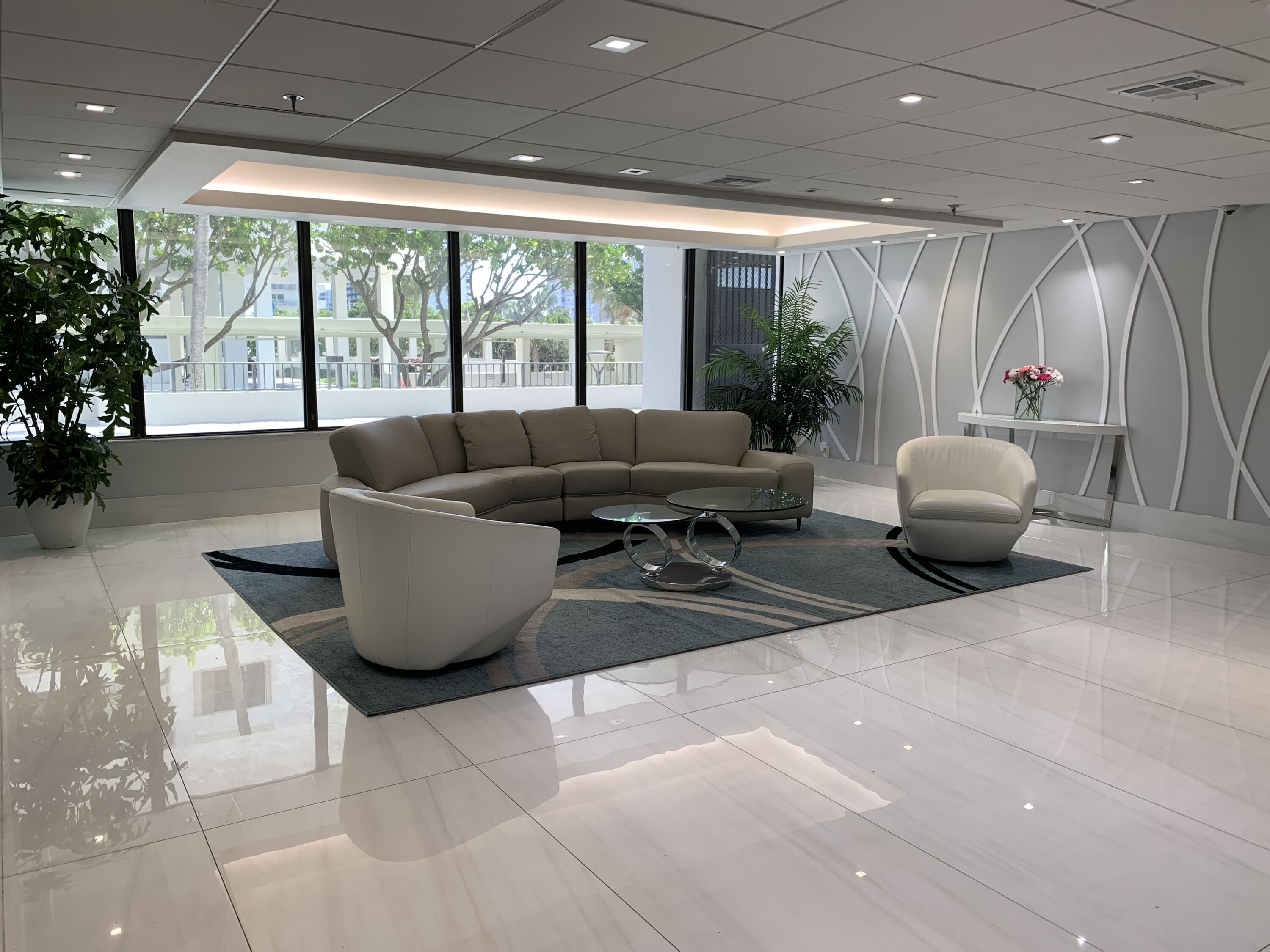 3115 South Ocean Boulevard, Unit 1002 Highland Beach, FL 33487 - Photo 27 of 37 a living room with furniture and a large window