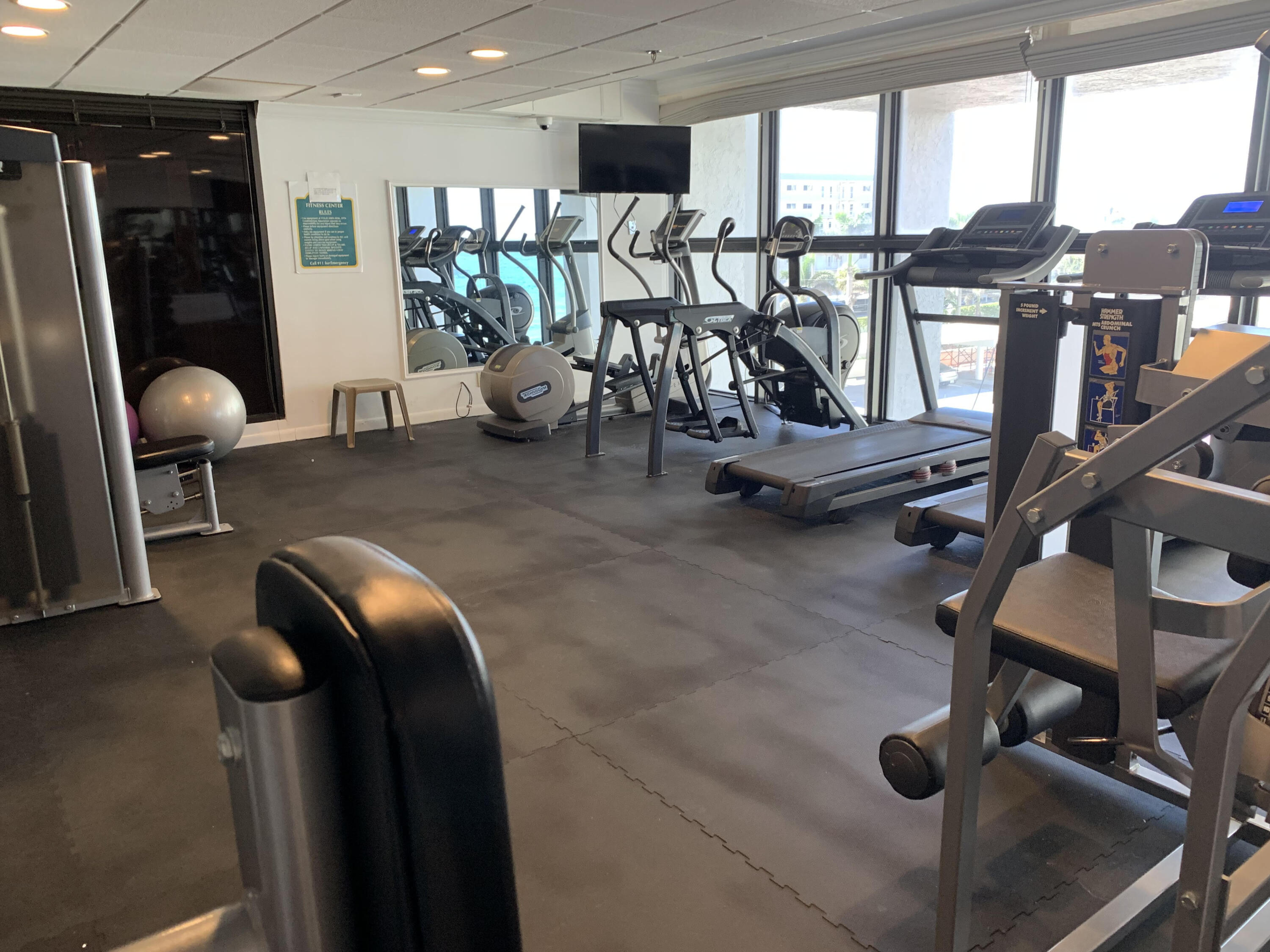 3115 South Ocean Boulevard, Unit 1002 Highland Beach, FL 33487 - Photo 28 of 37 a view of a room with gym equipment