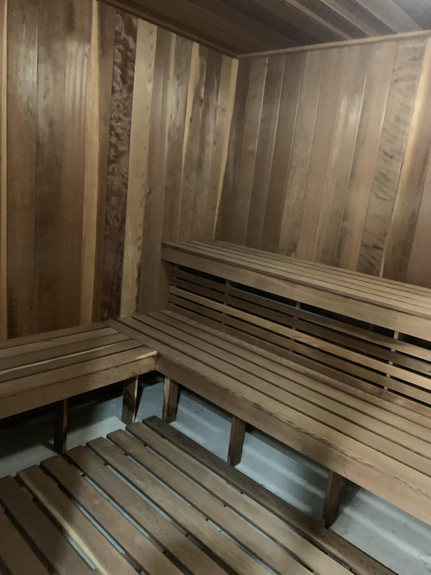 3115 South Ocean Boulevard, Unit 1002 Highland Beach, FL 33487 - Photo 32 of 37 a view of a wooden bench sitting in back of a building