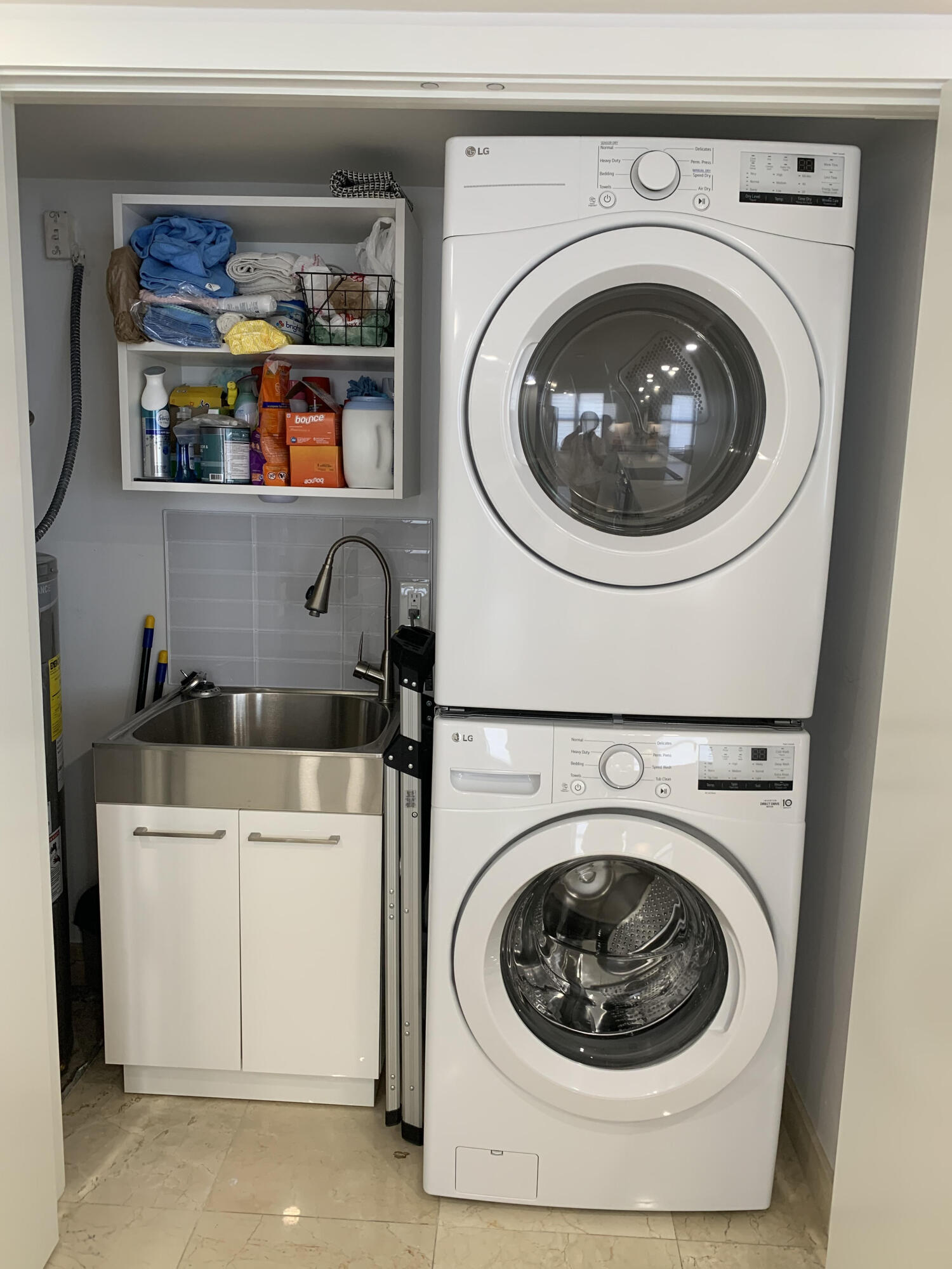 3115 South Ocean Boulevard, Unit 1002 Highland Beach, FL 33487 - Photo 36 of 37 a utility room with dryer and washer