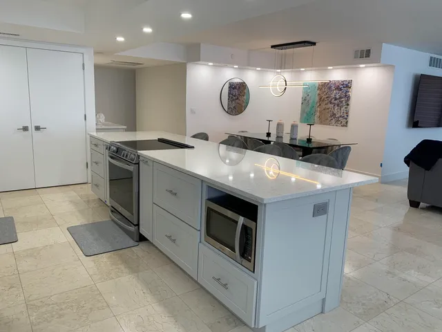 a kitchen with a stove and a sink