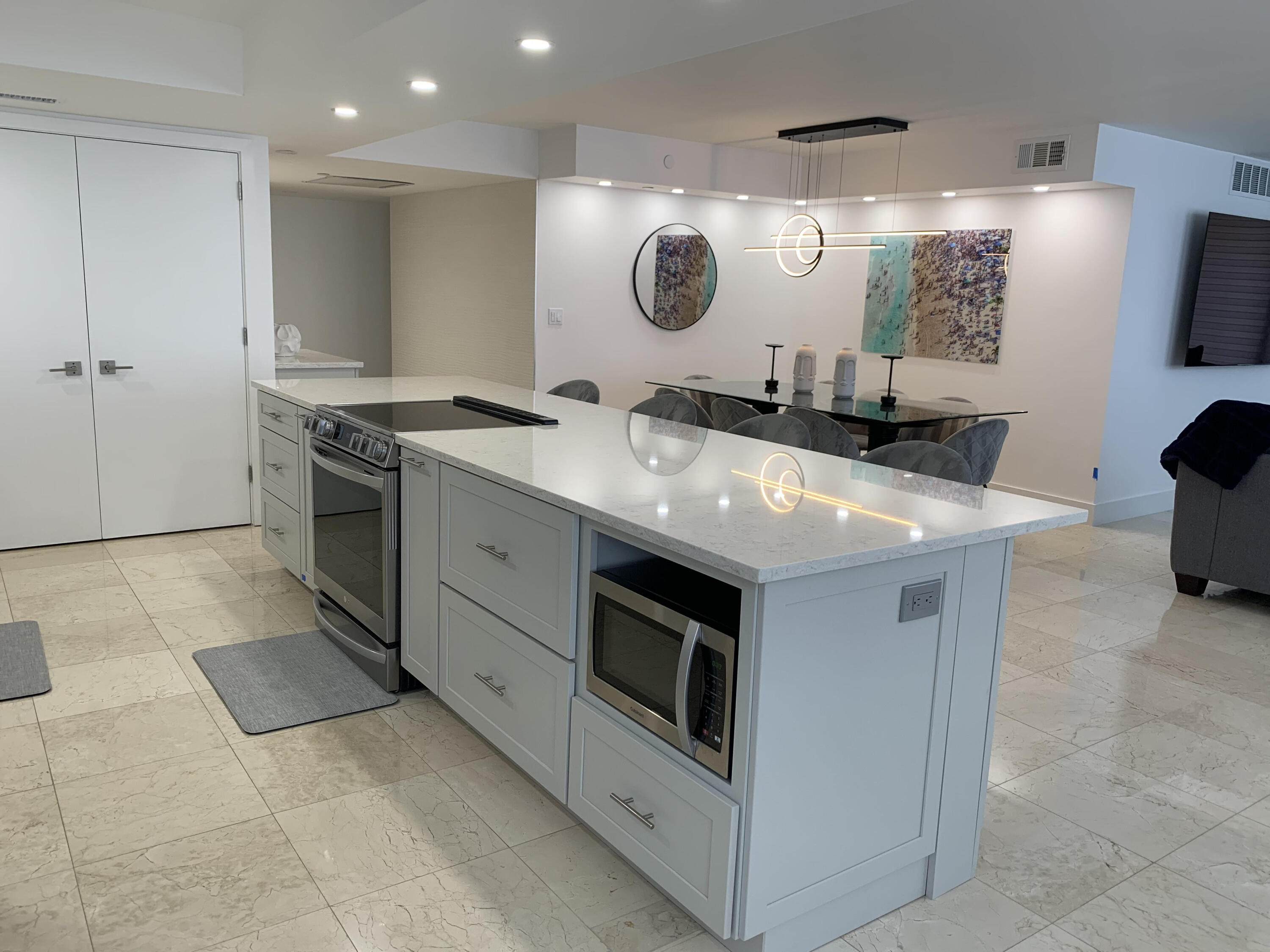 3115 South Ocean Boulevard, Unit 1002 Highland Beach, FL 33487 - Photo 5 of 37 a kitchen with a stove and a sink