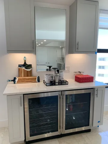 a sink with a stove and cabinets