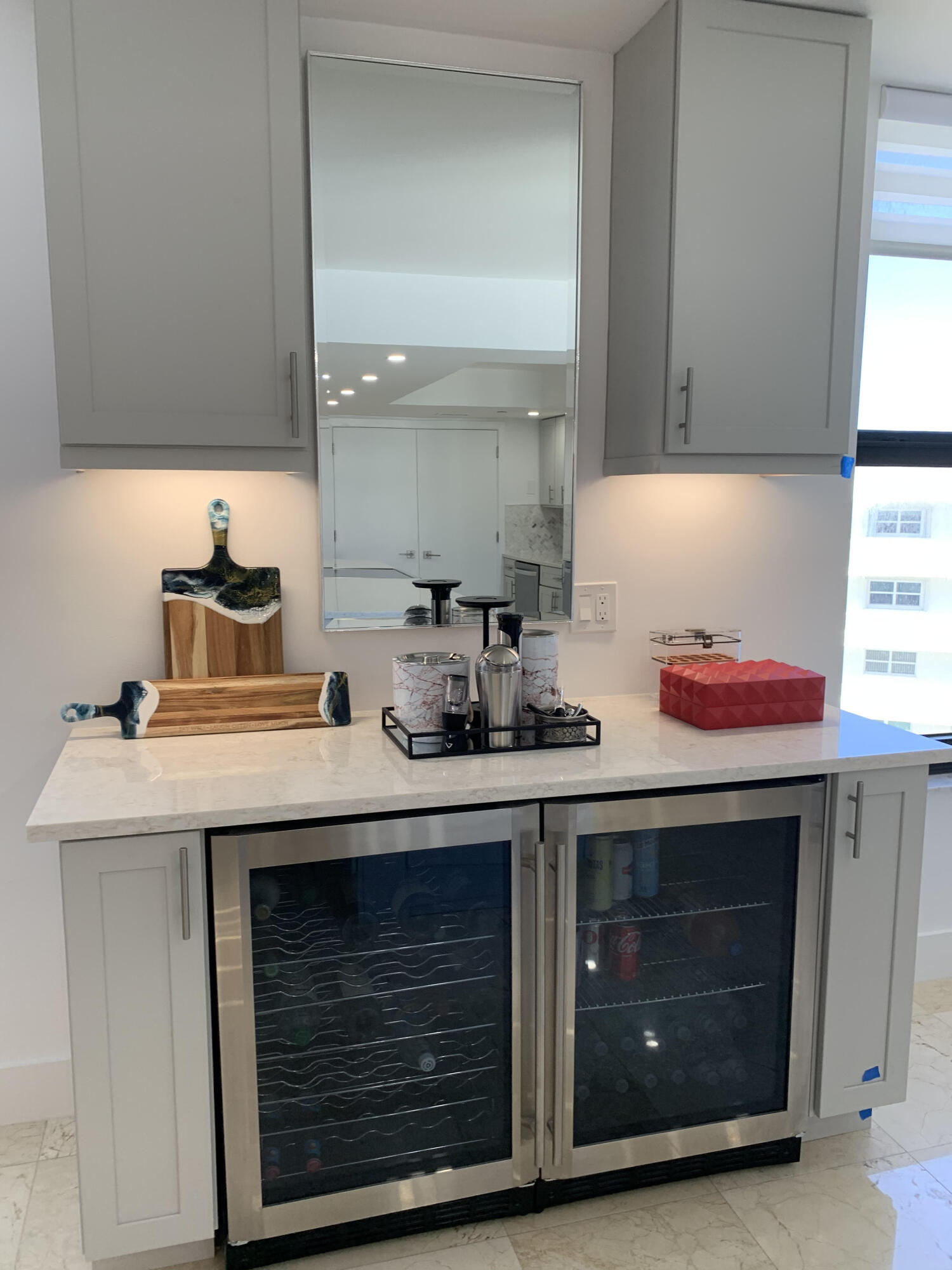 3115 South Ocean Boulevard, Unit 1002 Highland Beach, FL 33487 - Photo 6 of 37 a sink with a stove and cabinets