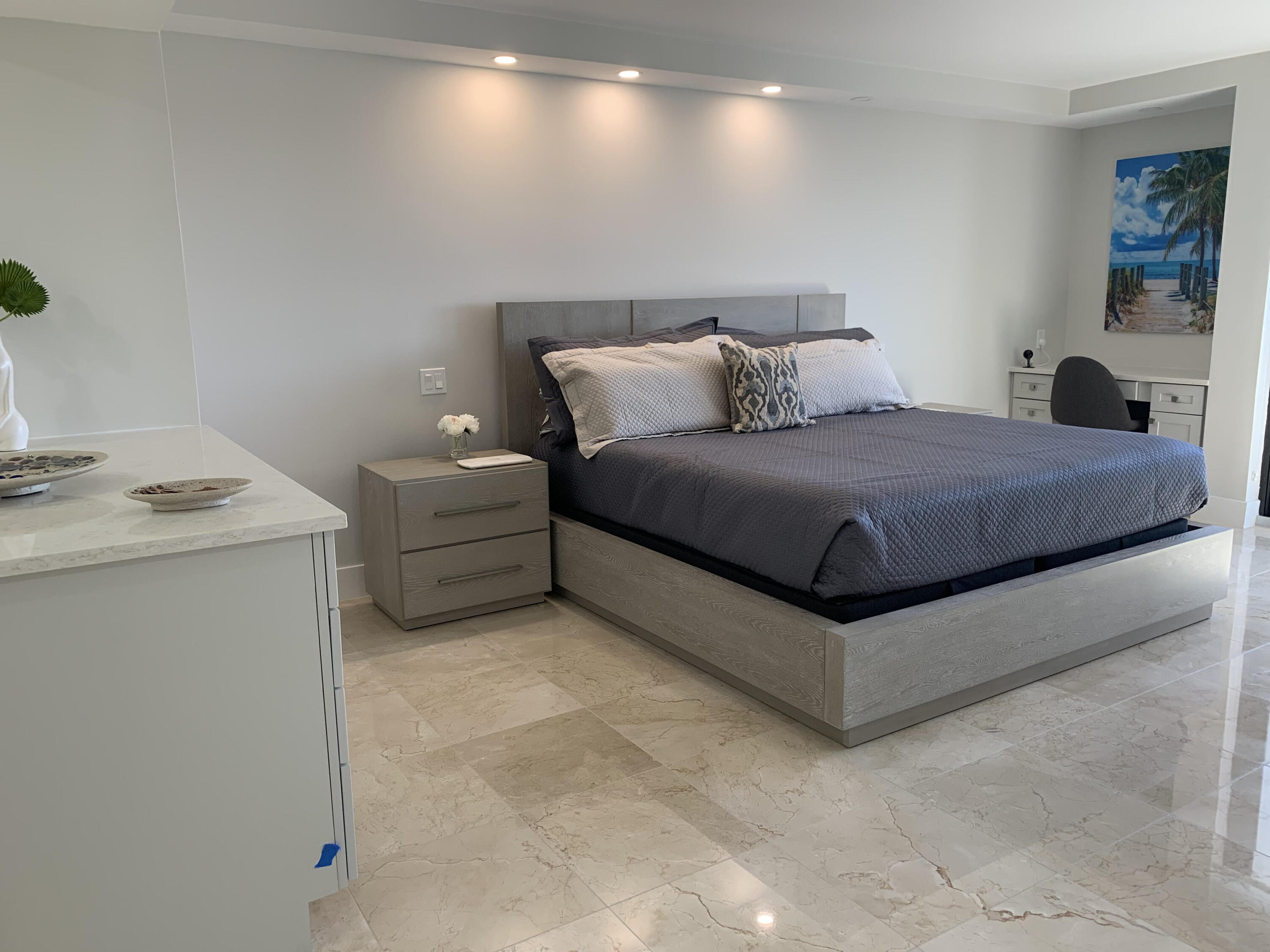 3115 South Ocean Boulevard, Unit 1002 Highland Beach, FL 33487 - Photo 10 of 37 a bedroom with a bed and a window