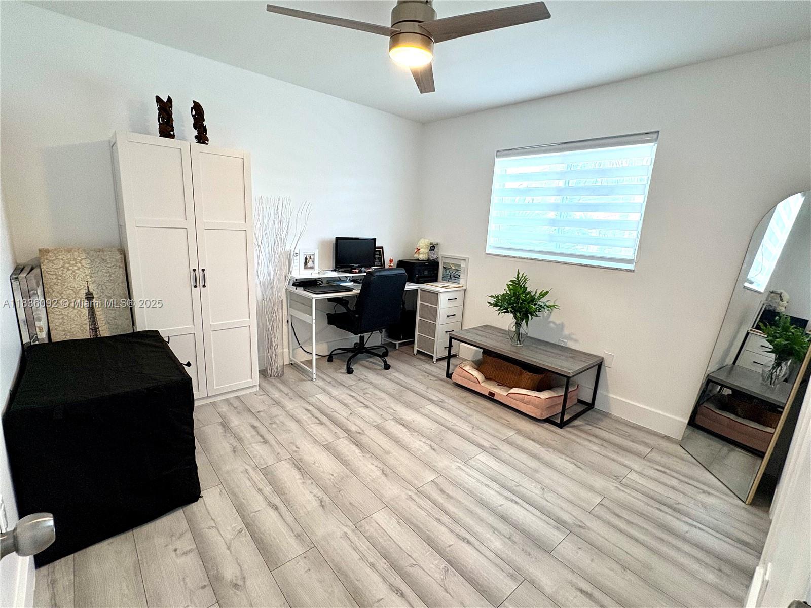 3320 Southwest 139th Avenue Miami, FL 33175 - Photo 12 of 23 a living room with furniture and a window