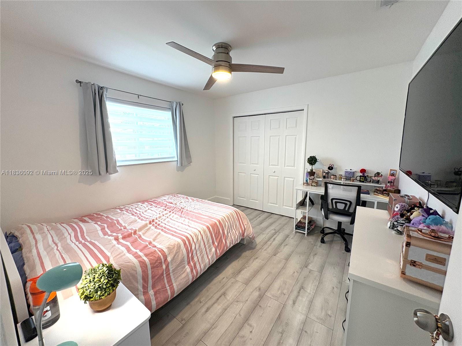 3320 Southwest 139th Avenue Miami, FL 33175 - Photo 13 of 23 a bedroom that has a bed and a table in it