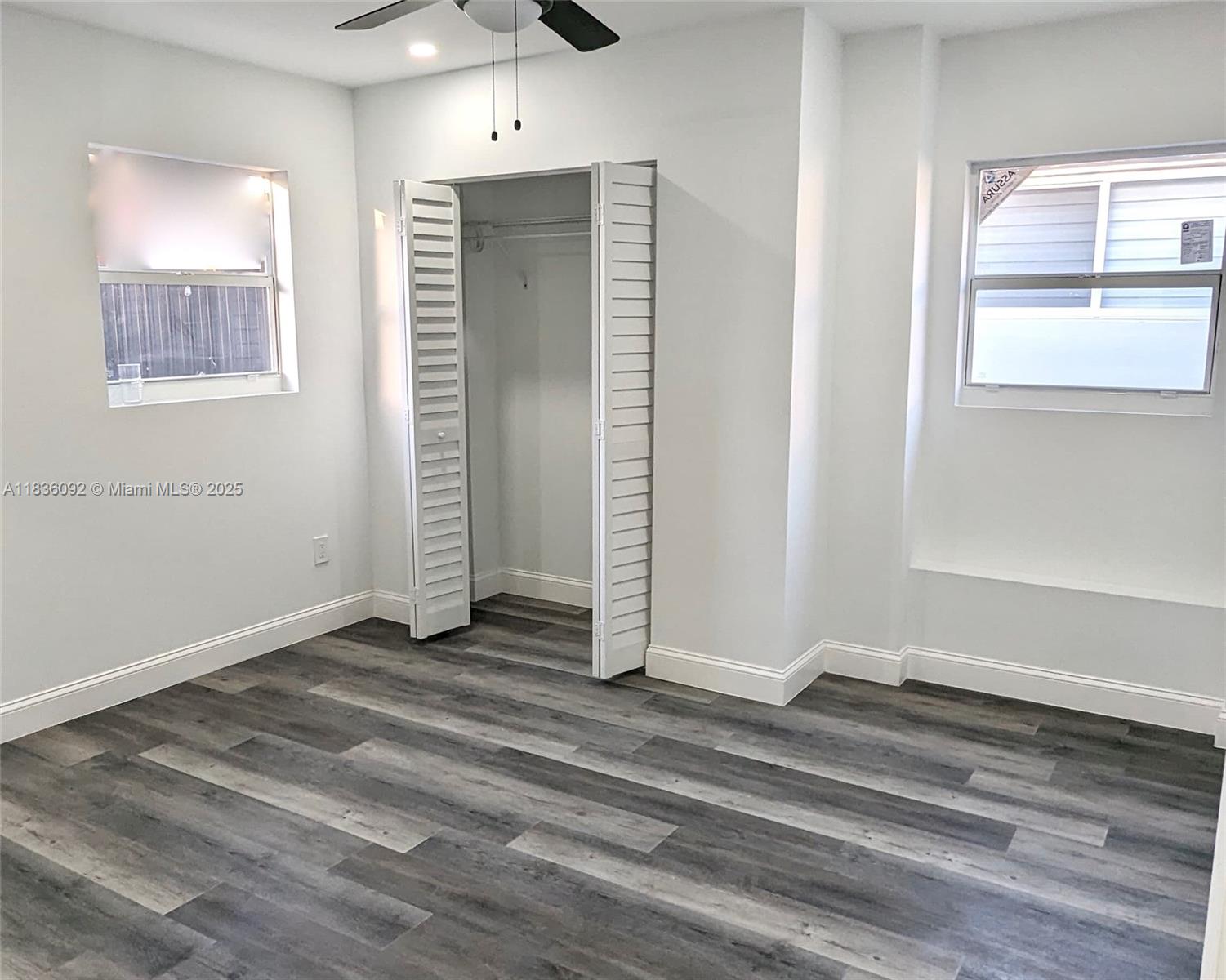3320 Southwest 139th Avenue Miami, FL 33175 - Photo 18 of 23 an empty room with wooden floor and windows