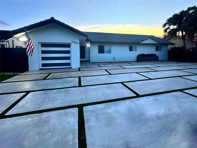 a bedroom with a large bed and a ceiling fan