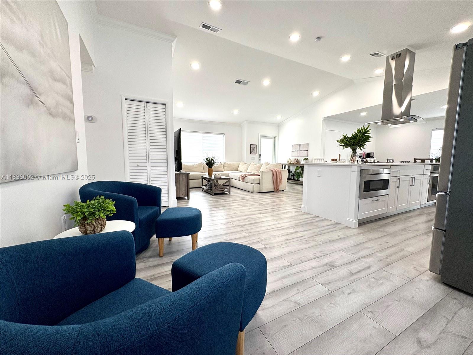 3320 Southwest 139th Avenue Miami, FL 33175 - Photo 5 of 23 a living room with furniture kitchen view and a refrigerator