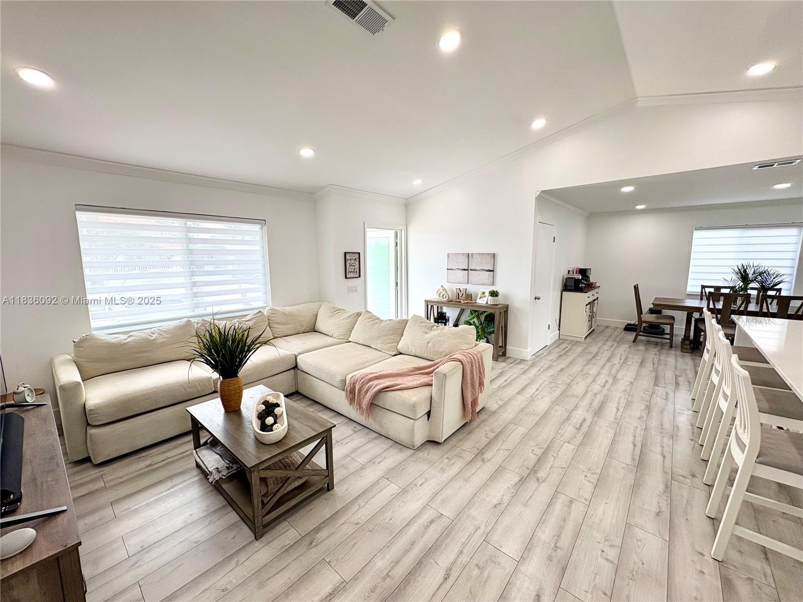 3320 Southwest 139th Avenue Miami, FL 33175 - Photo 6 of 23 a living room with furniture and a wooden floor