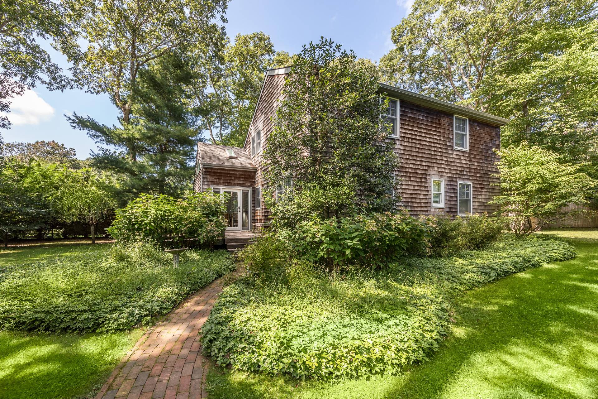 3 Spring Cl Lane East Hampton, NY 11937 - Photo 1 of 14 a view of a house with a yard