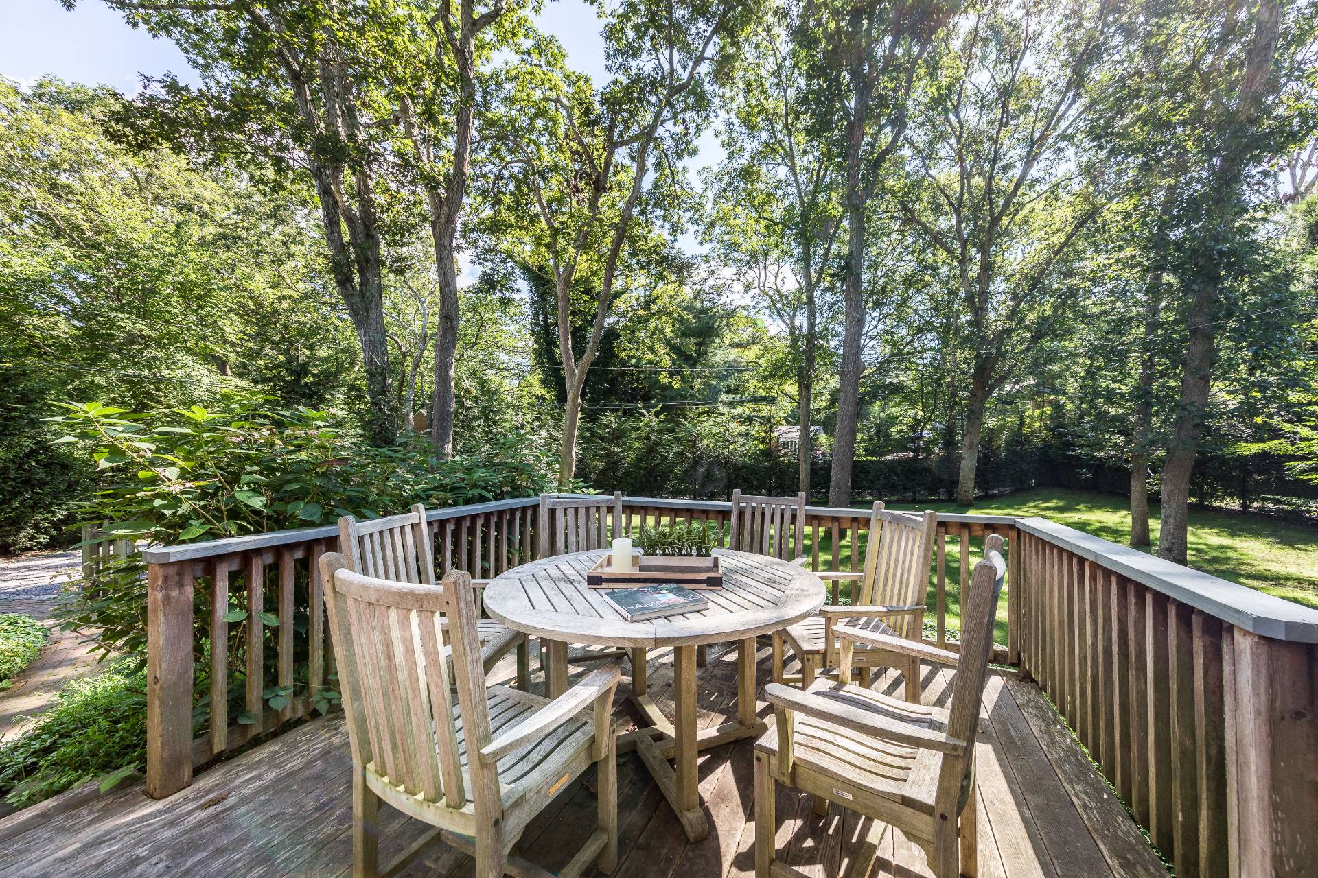 3 Spring Cl Lane East Hampton, NY 11937 - Photo 4 of 14 a view of a table and chairs on the roof deck