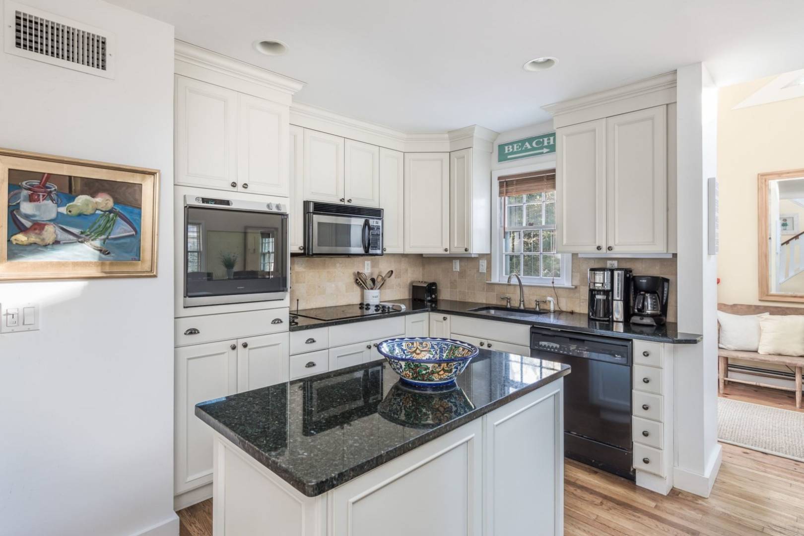 3 Spring Cl Lane East Hampton, NY 11937 - Photo 6 of 14 a kitchen with granite countertop a stove sink and microwave