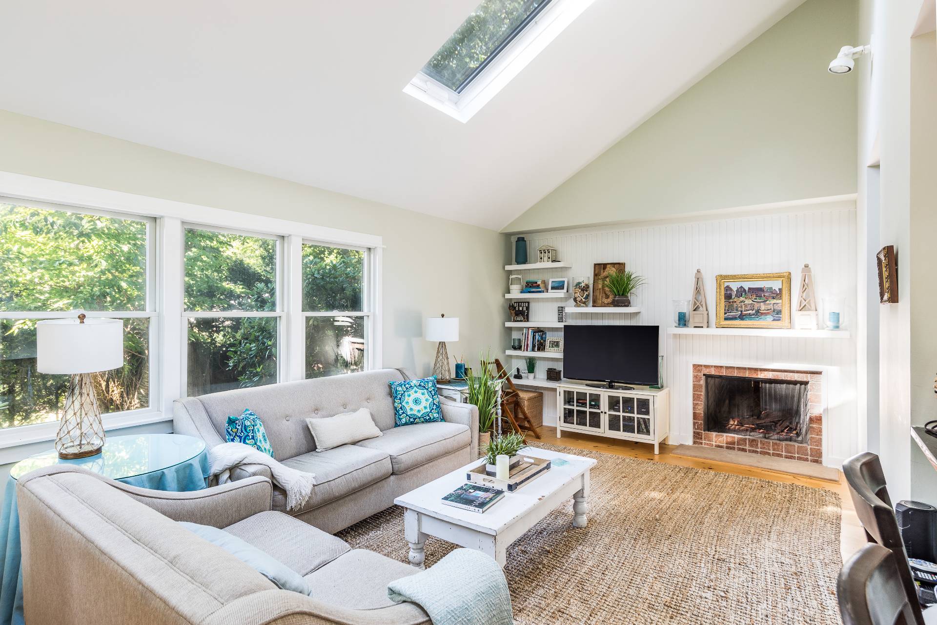 3 Spring Cl Lane East Hampton, NY 11937 - Photo 7 of 14 a living room with furniture a flat screen tv and a fireplace