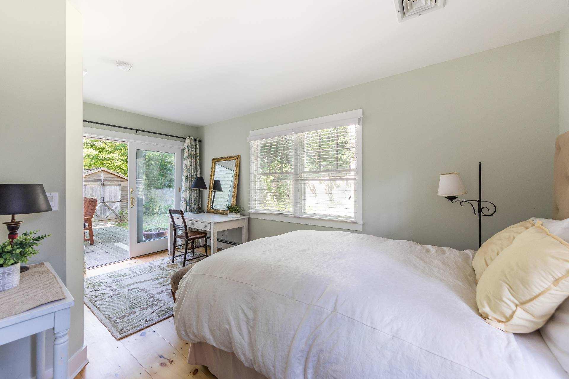 3 Spring Cl Lane East Hampton, NY 11937 - Photo 10 of 14 a bedroom with a bed a table and chair