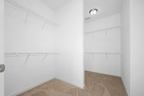 a view of a room with racks on the wall