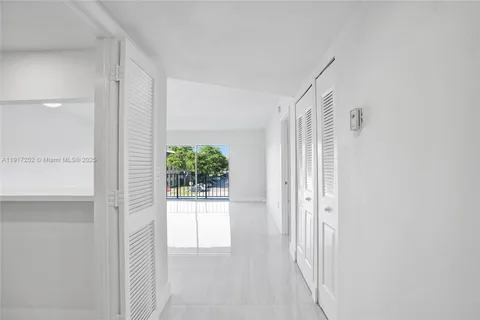 a view of a kitchen with a sink and a stove top oven