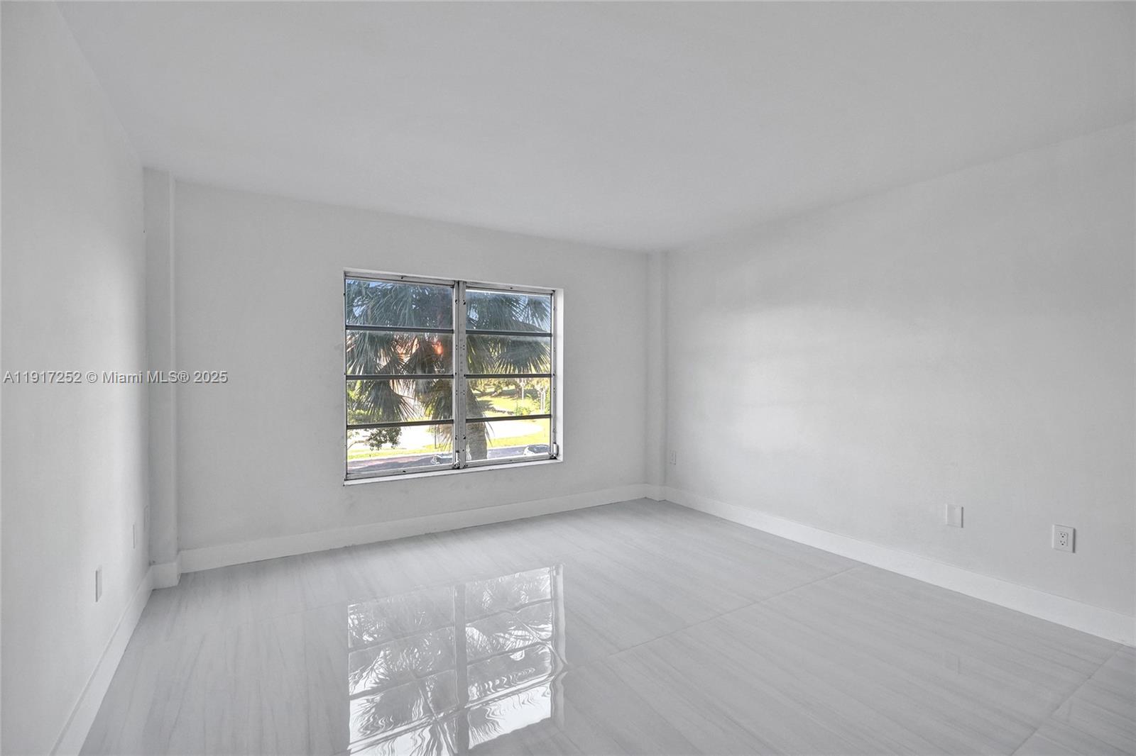 4164 Inverrary Drive, Unit 305 Lauderhill, FL 33319 - Photo 19 of 40 an empty room with a window