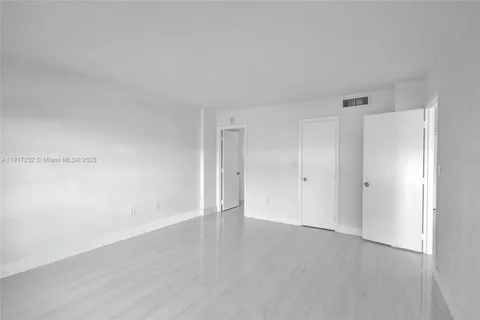 a bathroom with a bathtub shower sink vanity and toilet