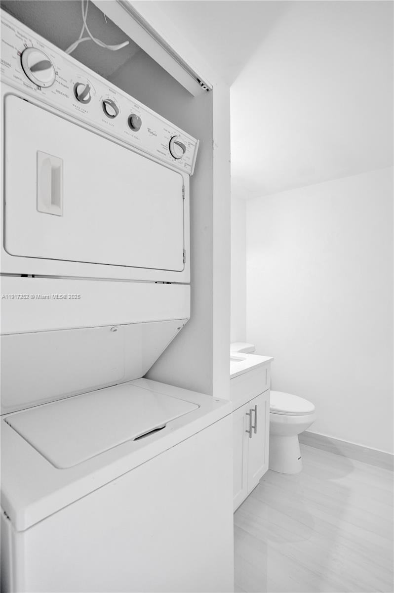 4164 Inverrary Drive, Unit 305 Lauderhill, FL 33319 - Photo 30 of 40 a utility room with dryer and washer