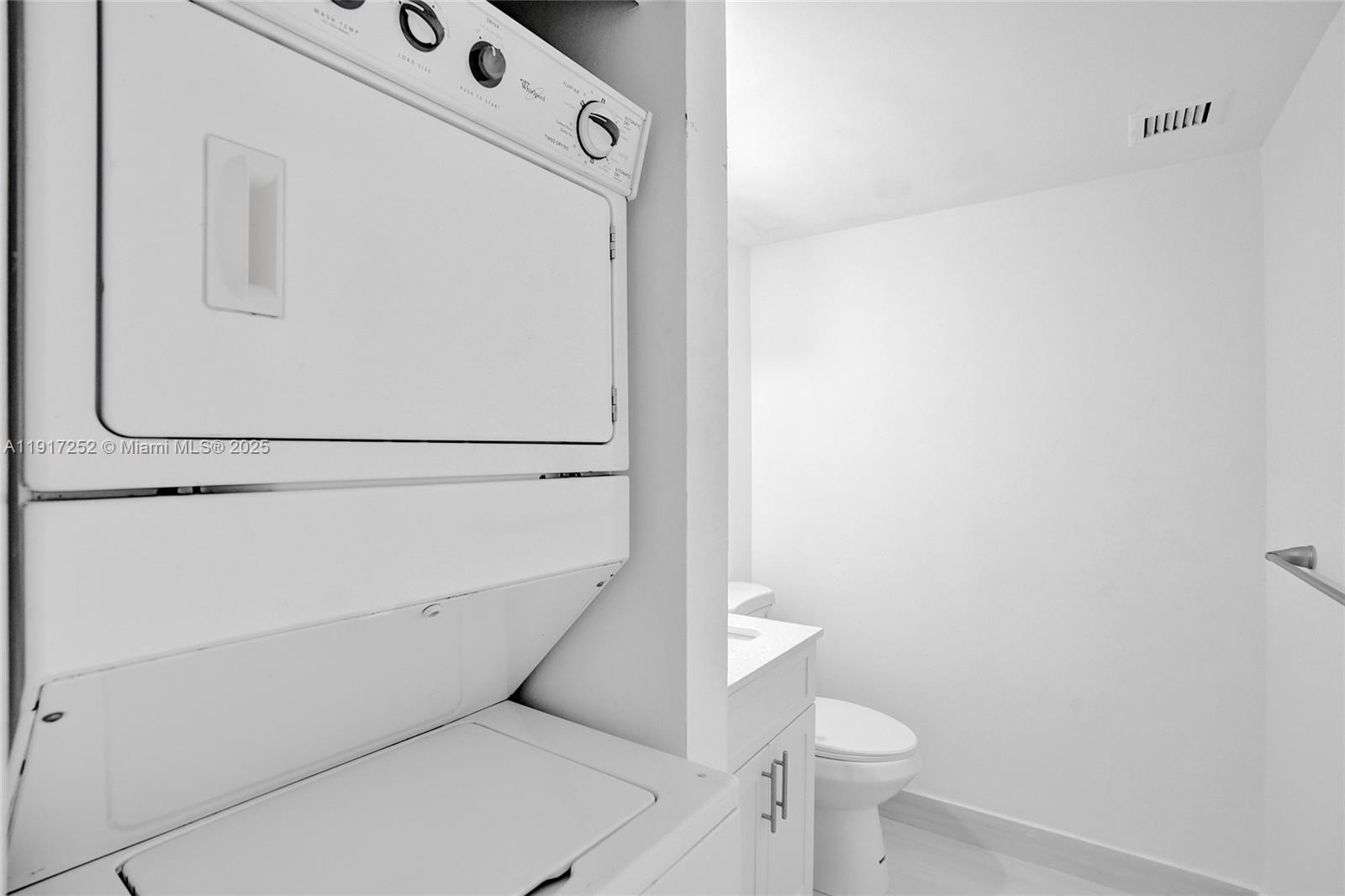 4164 Inverrary Drive, Unit 305 Lauderhill, FL 33319 - Photo 31 of 40 a utility room with dryer and washer